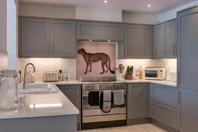 a kitchen with a dog statue on the stove at Finest Retreats - Fox and Hare in Shrawardine