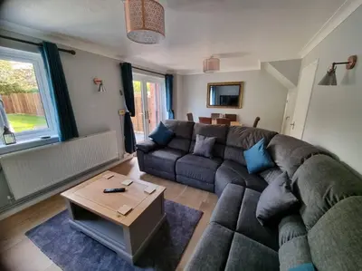 a living room with a couch and a table at 41 mortimer drive, ideal location near ludlow in Orleton
