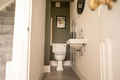 a bathroom with a toilet and a sink at Rose Hill in Shrewsbury