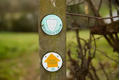 a pole with two signs on it at Pear Tree Cottage Shropshire in Orleton