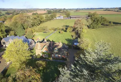 an aerial view of a house in a field at Green Gables in Eardisley