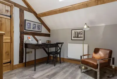 a room with a desk and a chair at The Timber Barn in Downton