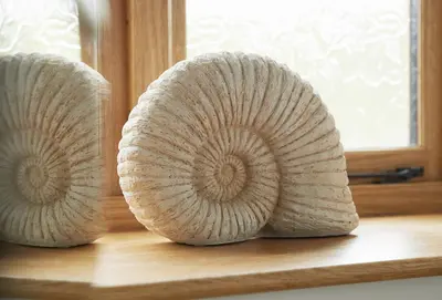 two rolls of bread sitting on a wooden table at The Stone Barn in Downton
