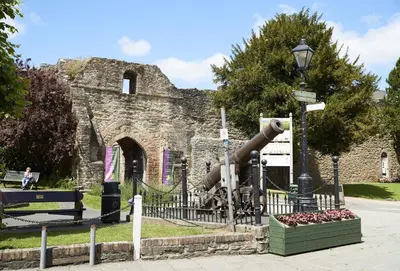 a cannon in front of an old stone building at The Stone Barn in Downton