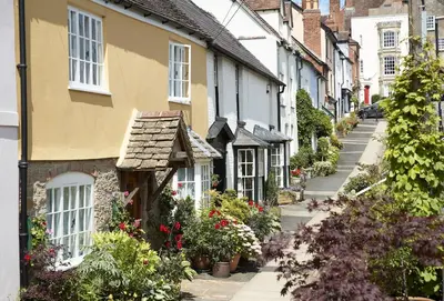 a street of houses with flowers and plants at The Groom's Flat in Leominster