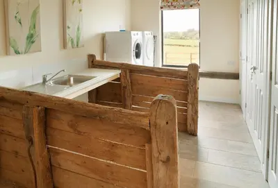 a kitchen with a sink and a microwave at Evenwood Granary in Kenley