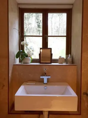 a white sink in a bathroom with a window at The Shippen - Open-plan barn conversion, high-spec, stunning views in Norbury