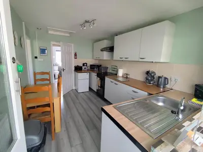 a kitchen with a sink and a counter top at Y Nyth in Newtown