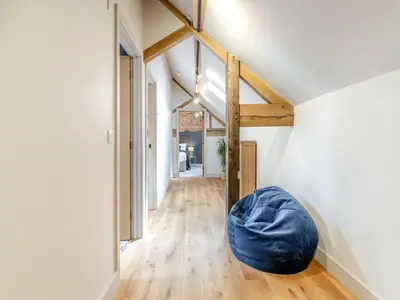 a room with a blue bean bag sitting on the floor at The Dairy - Uk44130 in Baystonhill