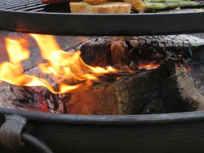 a fire is burning in a grill with bread at 3 Bed in Talybont-on-Usk oc-wal374 in Talybont