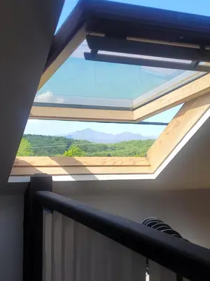 a window in the ceiling of a room with a view at Snowdon view, steam railway & Portmeirion nearby in Mynfford