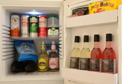 a refrigerator filled with lots of bottles of wine at The Mulberry Inn in Glyn-Ceiriog