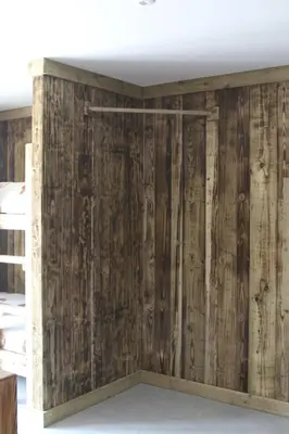 a room with wood paneling on the walls at The Moo-tel at Moody Meadows in Aberaeron