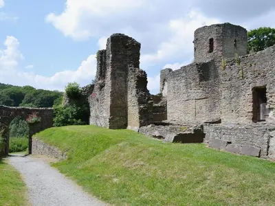 an old castle on a hill with a dirt road at Halford Big Barn in Halford