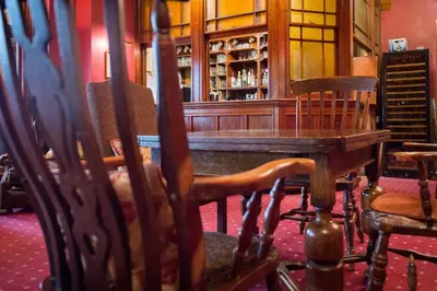 a dining room with a table and chairs at Lake Vyrnwy Hotel & Spa in Llanwddyn