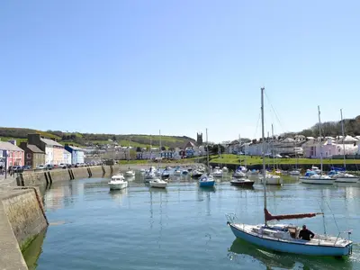 a group of boats docked in a harbor at Cartws-Oh3 in Dihewid