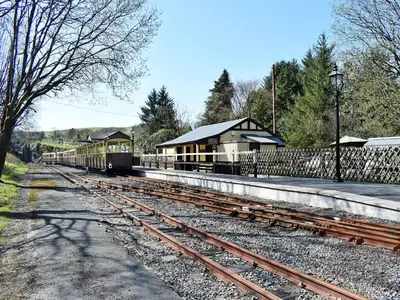 a train station with a train stationasteryasteryasteryasteryasteryasteryasteryasteryastery at The Glen in Devils Bridge