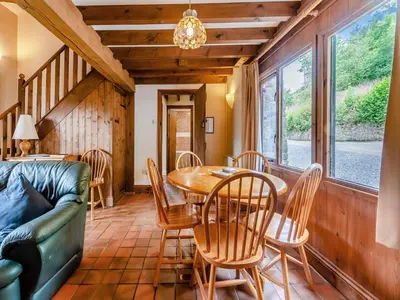 a living room with a table and chairs and a couch at Rhyblid Fach in Myddfai