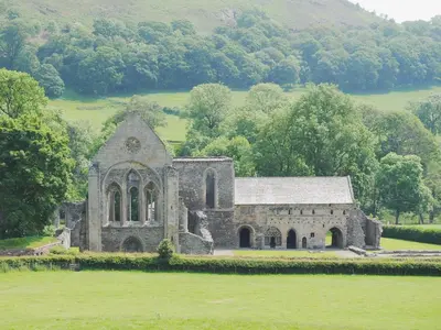 an old stone church in the middle of a field at Maesmor in Bala