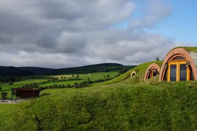 a small dome house on a hill with a bench at Foxes View in Rhayader