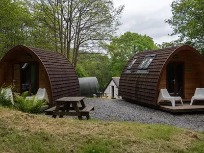 a couple of tents with a picnic table and a bench at YHA Brecon Beacons in Brecon