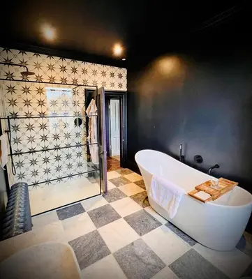 a large bathroom with a tub and a shower at Llanerchydol Hall Suites in Welshpool