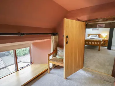 a door leading into a bedroom with a bunk bed at Penarth in Llandrindod Wells
