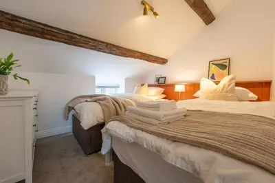 a bedroom with two beds in a room at Stylish, comfortable, convenient! in Bala