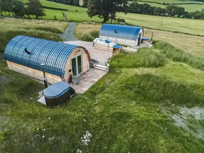 an overhead view of two huts in a field at Barcud Coch - Uk44539 in Hirnant