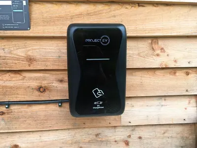 a black remote control hanging on a wooden wall at Barcud Coch - Uk44539 in Hirnant