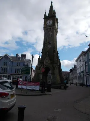 a clock tower in the middle of a street at The White Lion Hotel in Machynlleth