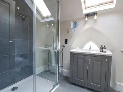 a bathroom with a shower and a sink at The Old Chapel in Hereford