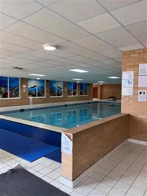 a large swimming pool in a large building at Wonderful 2 bedroom mobile home in Aberystwyth