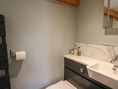 a bathroom with a sink and a toilet at Celyn in Welshpool