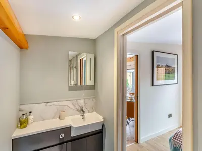 a bathroom with a sink and a mirror at Celyn - Uk40258 in Llangadfan