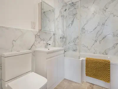 a white bathroom with a sink toilet and a tub at Jacobs Plock in Leintwardine