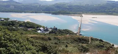 an aerial view of a beach and a body of water at Seasalt Loft in Barmouth