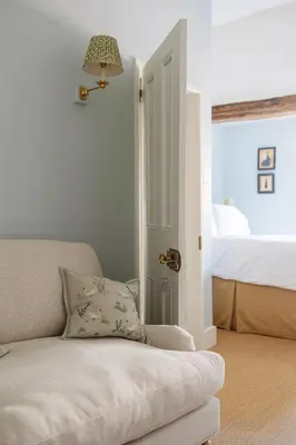 a living room with a couch and a bed at Ludlow Townhouse in Ludlow