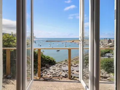 a view of the ocean from a window at Windycroft in Barmouth