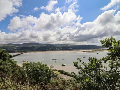 a large body of water with boats in it at Windycroft in Barmouth
