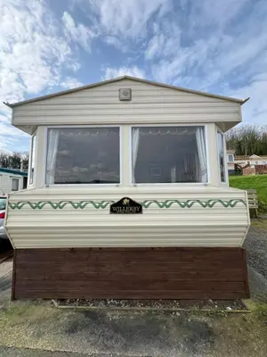 a camper is parked in a parking lot at Holiday Home by the sea in Aberystwyth
