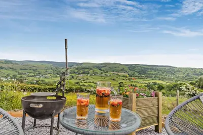a table with three glasses of beer on it at 1 Bed in Llangadfan oc-c27292 in Llangadfan