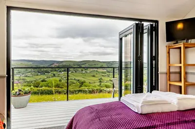 a bedroom with a large window with a view at 1 Bed in Llangadfan oc-c27292 in Llangadfan