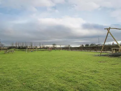an empty park with a bunch of playground equipment at Swan in Leominster