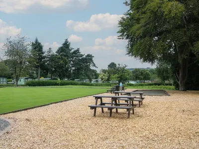 a row of picnic tables in a park at Swan in Leominster