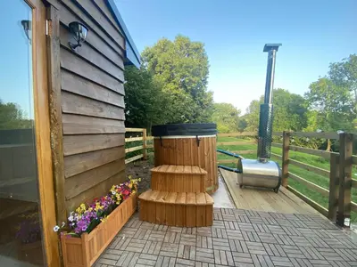 a wooden deck with a japanese garden with a japanificialificialificial at The Haystack in Oswestry