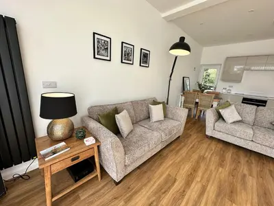 a living room with two couches and a table at The Lawley in Shrewsbury