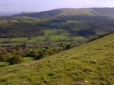 a view of a green field from the top of a hill at Stargazing lodge with amazing views. in Llandrindod Wells