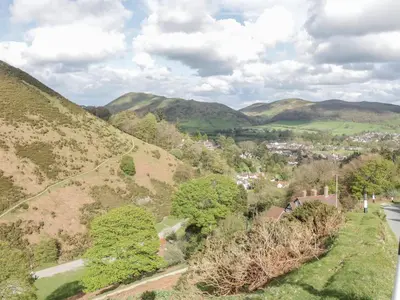 an aerial view of a valley with hills and trees at Bluebell's Cottage in Shrewsbury