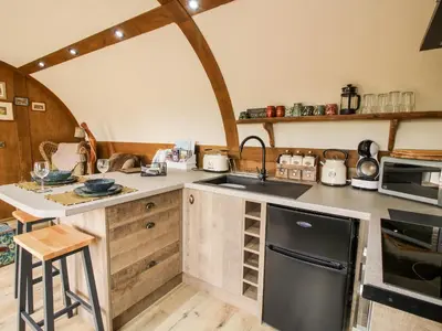 a kitchen with a sink and a stove top oven at Shire's End in Caynham